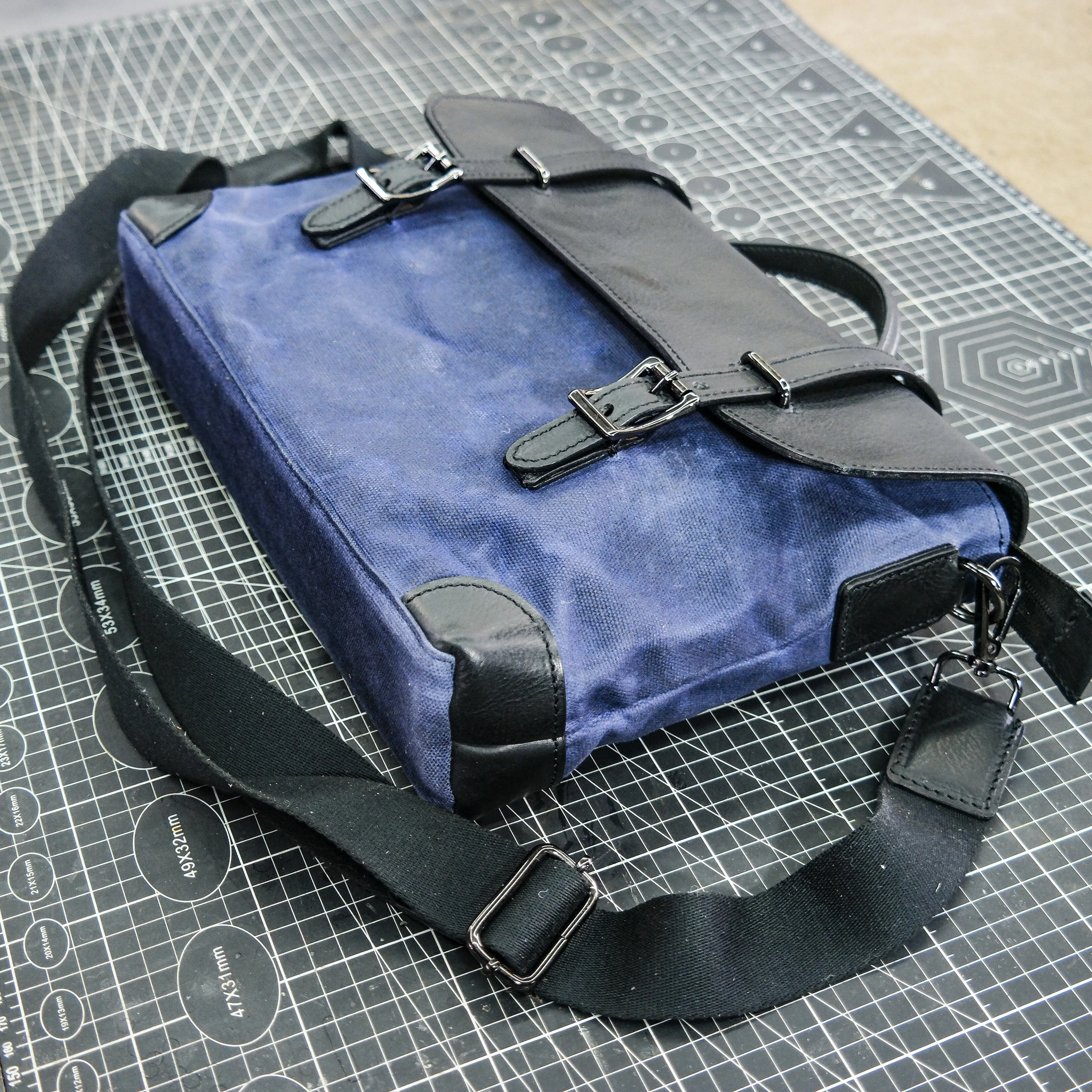 Black vegetable tanned blue waxed canvas men's and women's crossbody bag