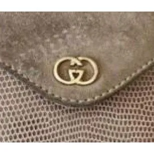 Gucci honey lizard leather bucket bag with gold chain strap