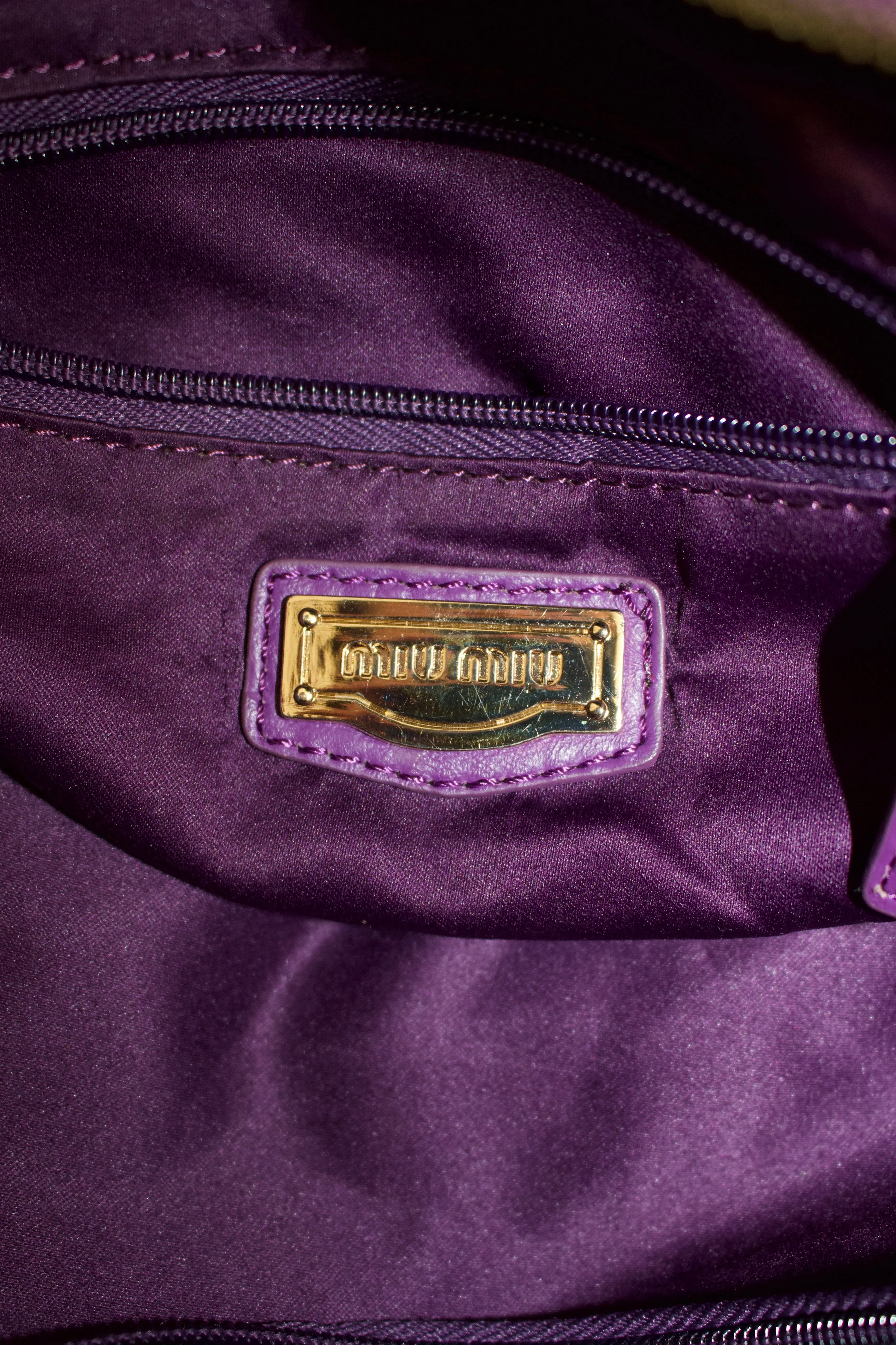 Miu Miu purple woven leather shoulder bag with tassels
